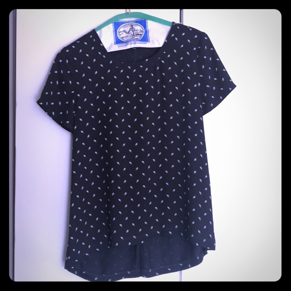 Navy shirt with feather design on it
